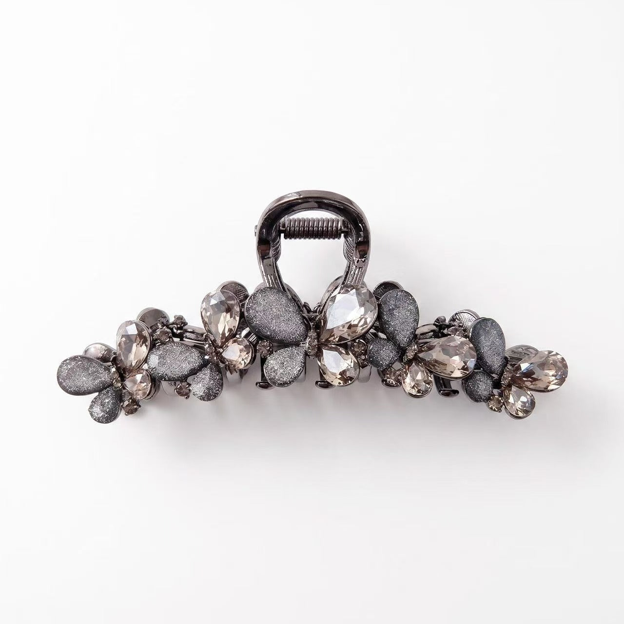 Dark butterfly hair claw clip with smoky rhinestones and textured gray wing details